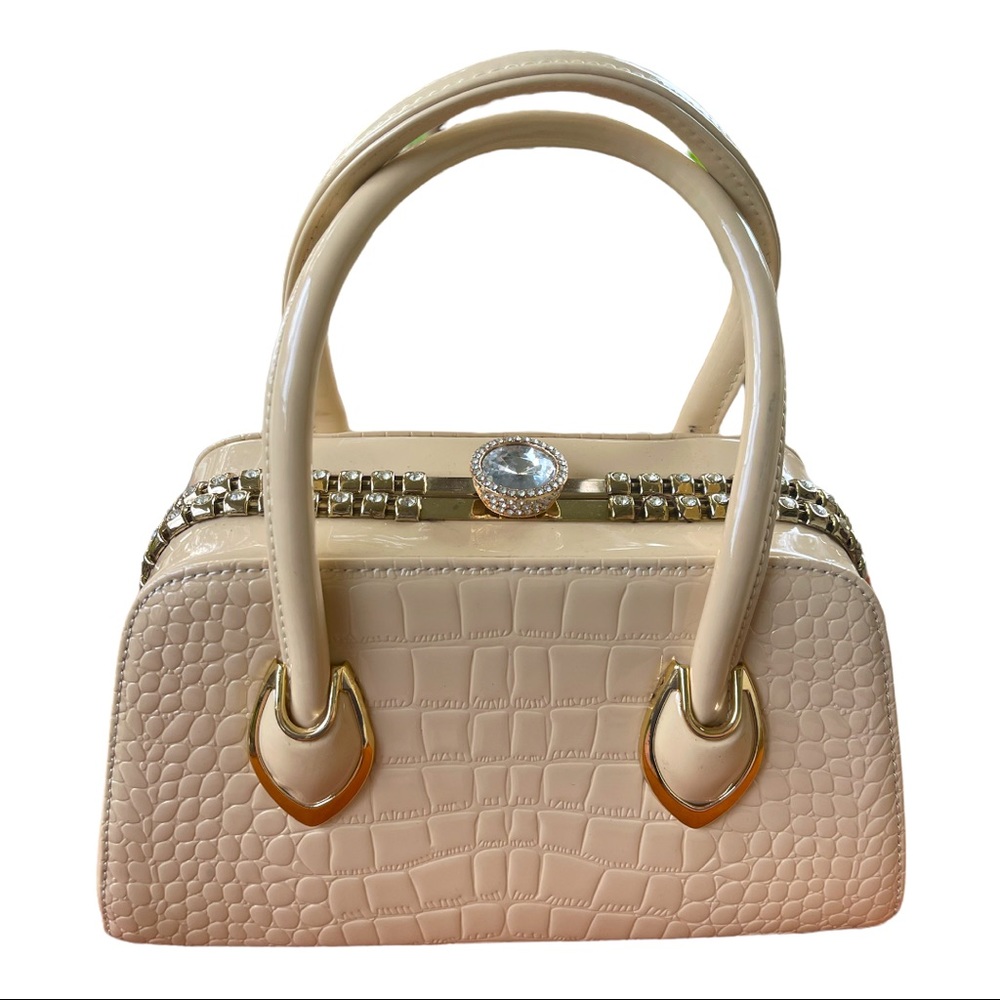 Cream Diophy purse with gold trim.  Faux Diamonds